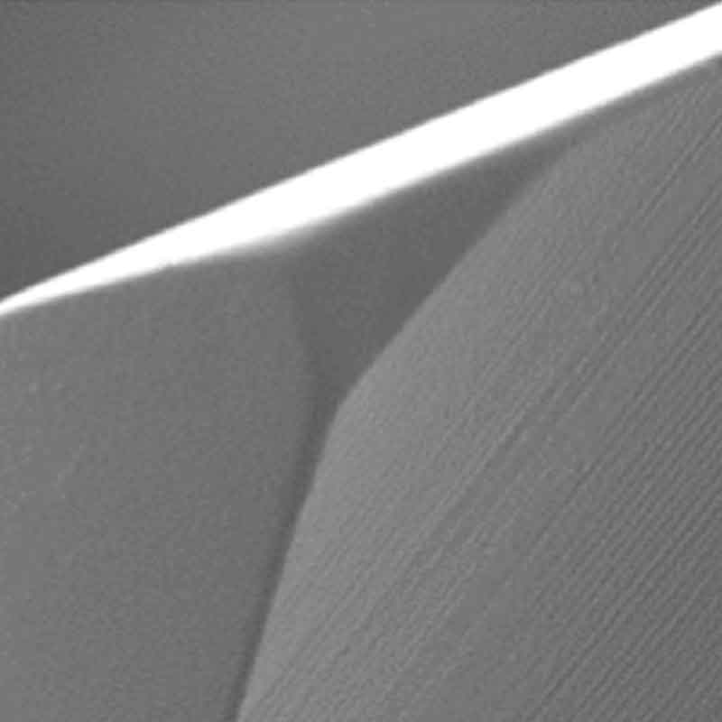 FLATCOAT® TTN coating surface under electron microscope — smooth, droplet-free nanocoating